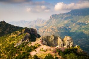 View of Big Bend National Park from above with dramatic hills and rocky landscape, one of the best road trips from Austin