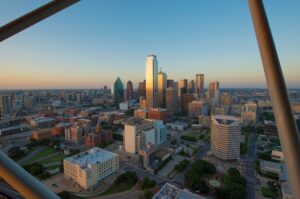 View of Dallas skyline from Reunion Tower with bars visible in the foreground. Reunion Tower is one of the most instagrammable places in Dallas!
