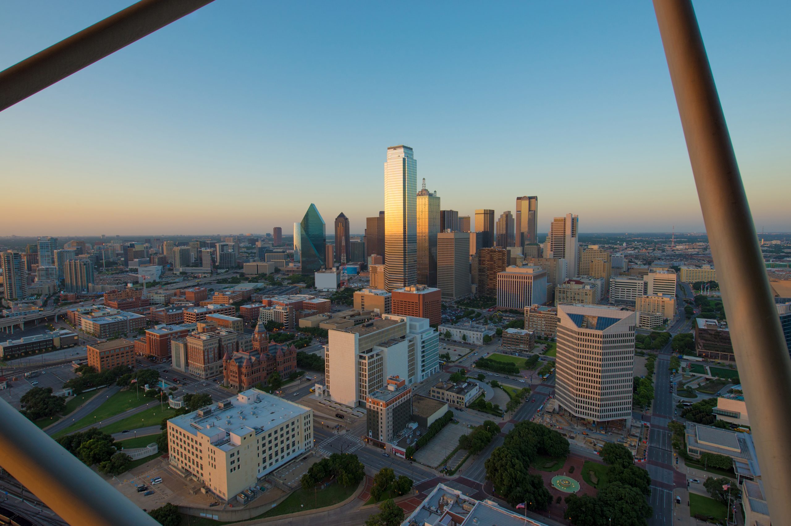 View of Dallas skyline from Reunion Tower with bars visible in the foreground. Reunion Tower is one of the most instagrammable places in Dallas!