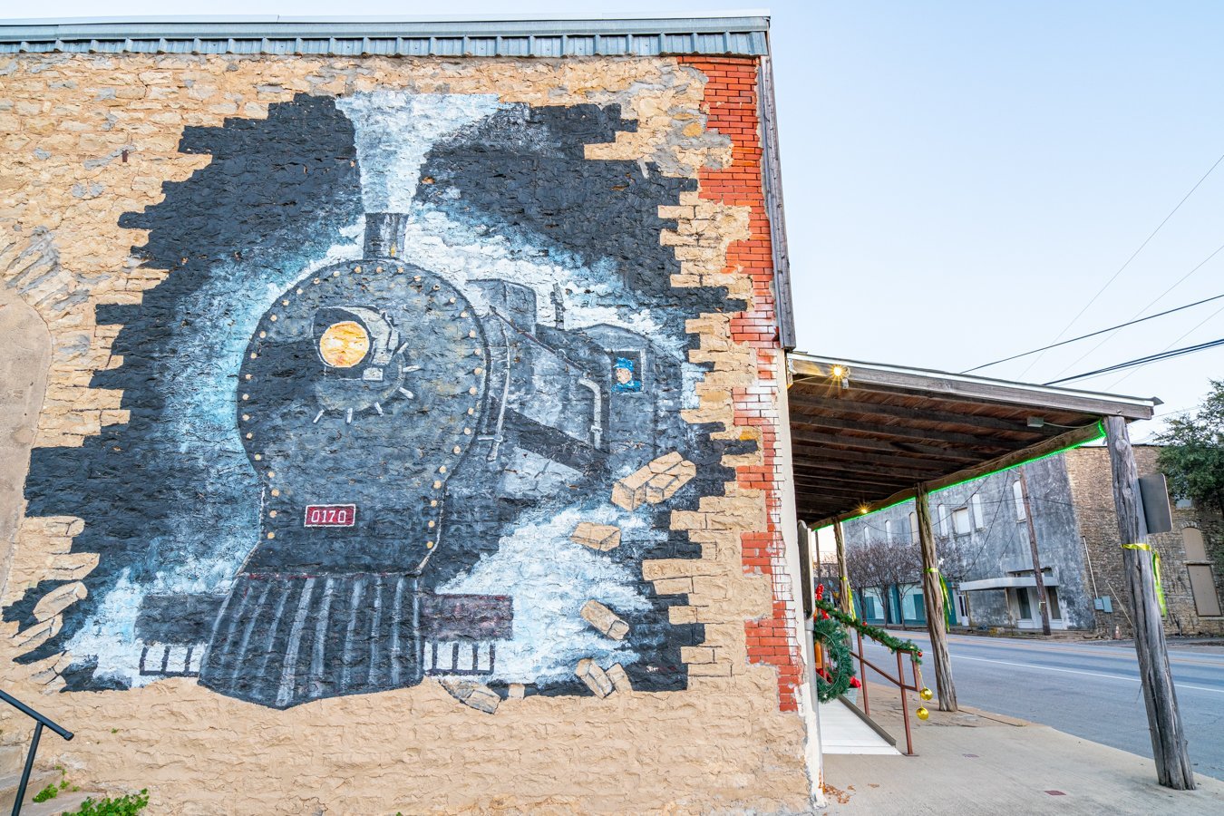 mural of an old fashioned train painted on a brick wall in dublin tx, one of the best day trips from fort worth texas