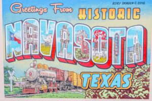 close up of "greetings from historic navasota" mural, one of the best things to do in navasota texas