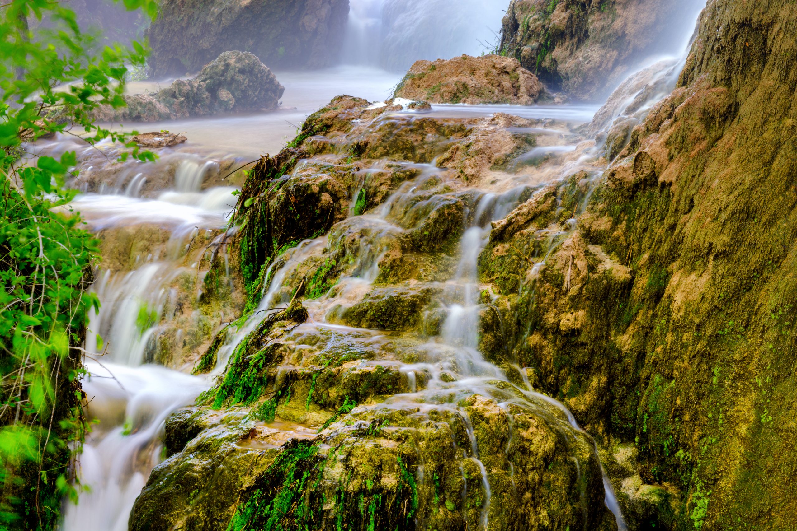 close up of gorman falls in colorado bend, one of the best texas state parks near austin tx