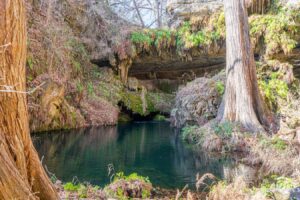 waterfall of westcave preserve, an amazing stop on a texas hill country road trip itinerary