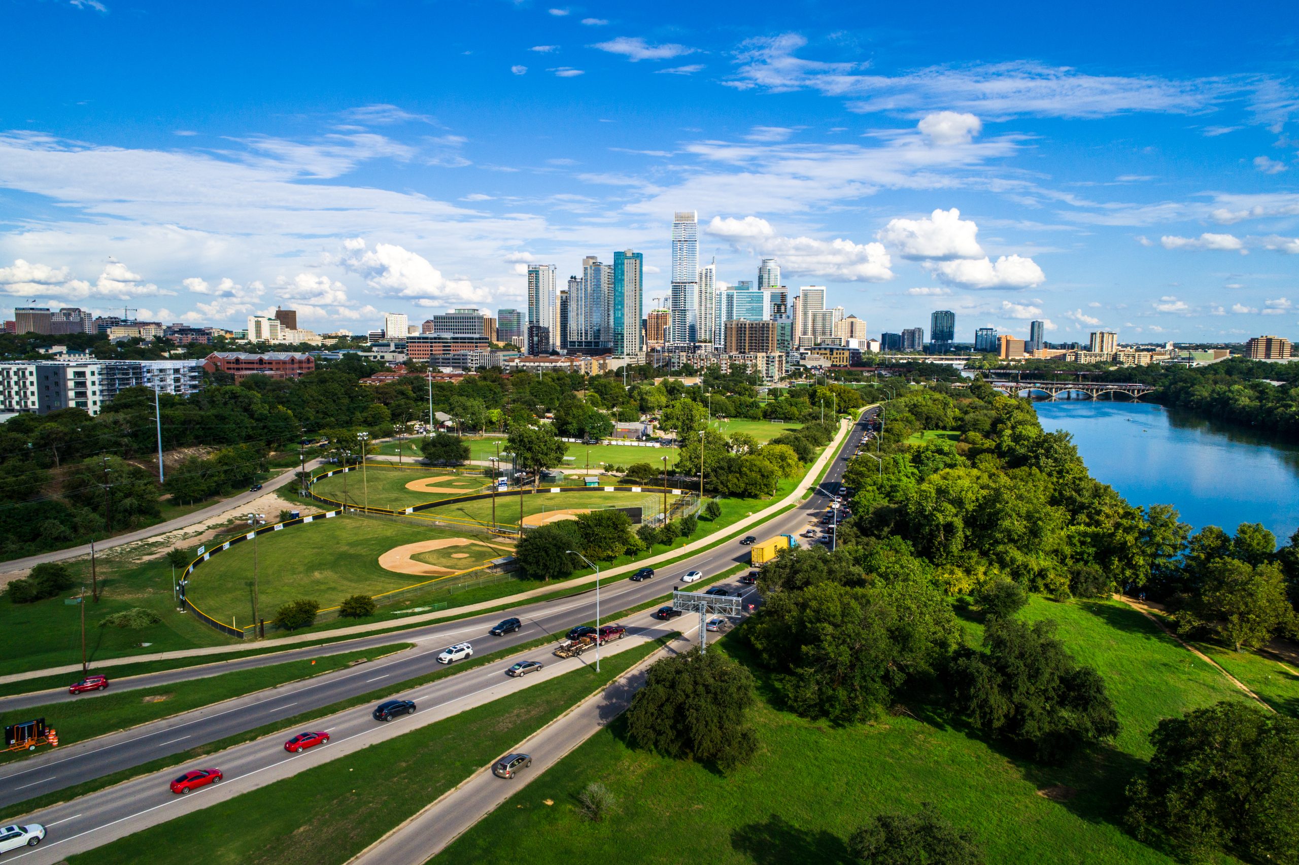 aerial view of austin texas skyline with road in the foreground, with traffic typical of driving from dallas to austin texas