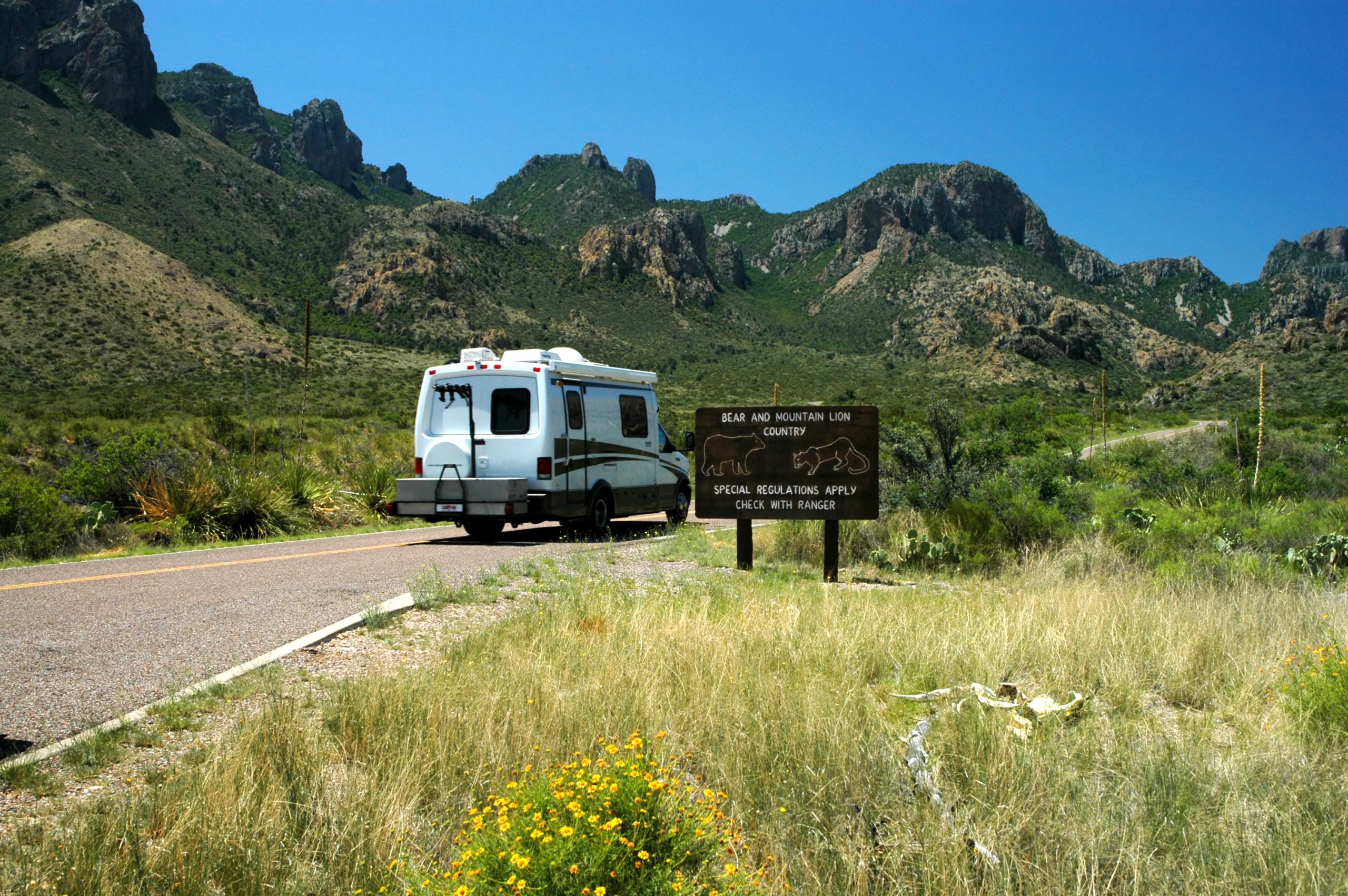 small white rv in big bend np driving to one of the best rv parks near big bend national park