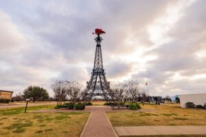 eiffel tower in paris tx as seen from parking lot, one of the best roadside attractions in texas